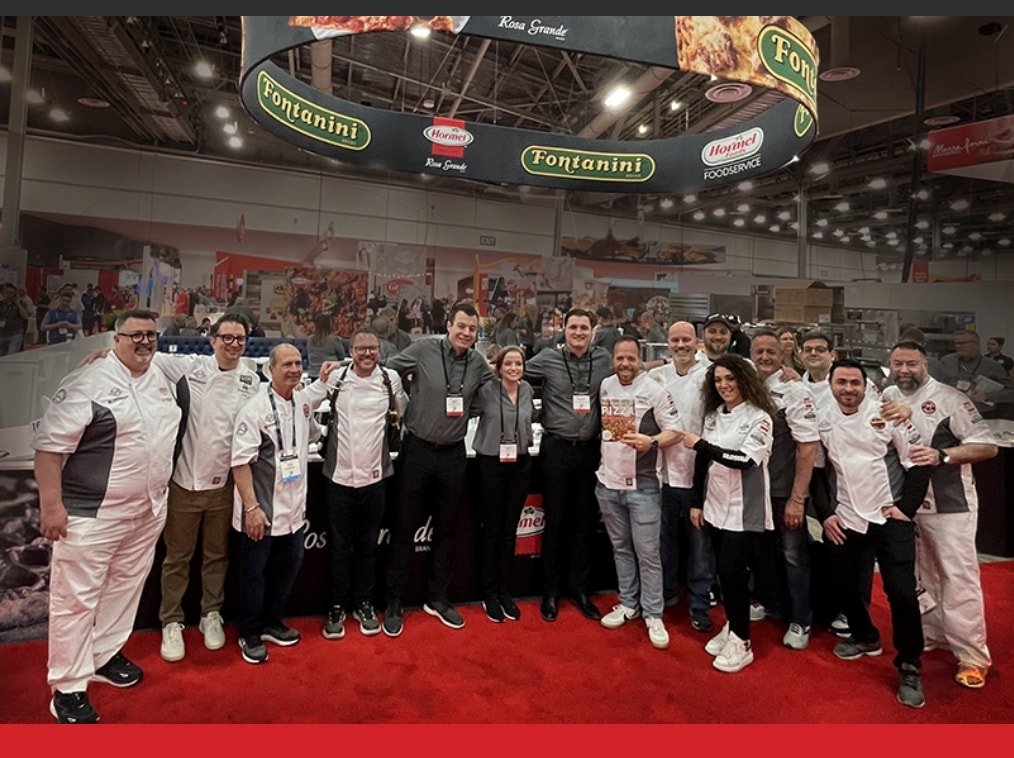 a crowd of people representing the World Pizza Champions