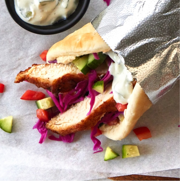 slices of battered sous-vide chicken in a shawarma wrap