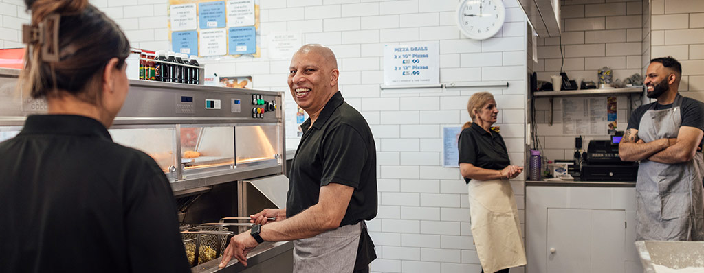 Family meal, staff hanging out in kitchen